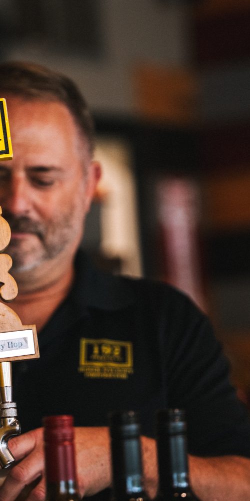 Man pulling beer tap