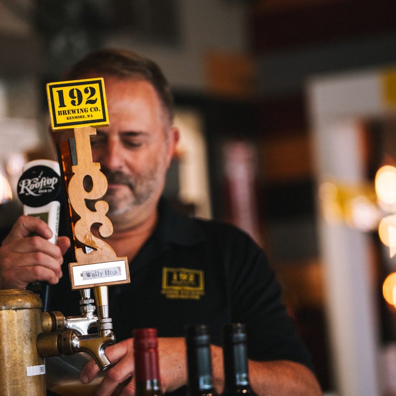 Man pulling beer tap